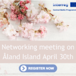 A picture of spring flowers with the text networking meeting on Åland.