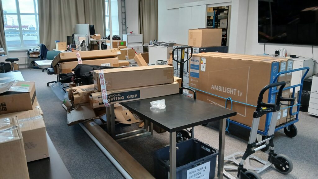 Room filled with boxes of electronic components.