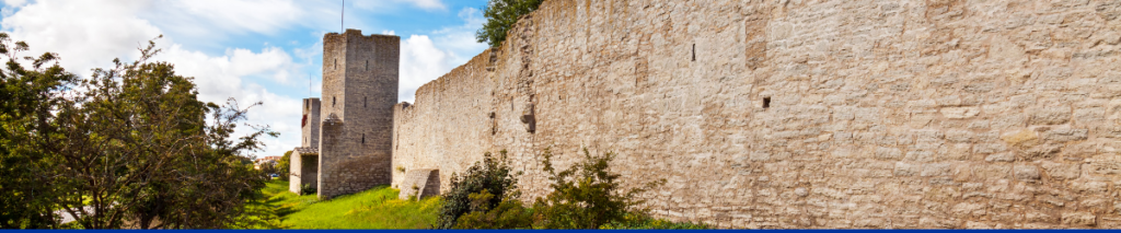 Decorative image showing historical wall in summer in Visby, Sweden.